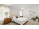 Main bedroom featuring neutral walls, carpet floors, side tables, and ample natural light at 141 Yarrow Way, Moncks Corner, SC 29461