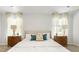 Bright main bedroom with carpeted floors, stylish decor, side tables and natural light at 141 Yarrow Way, Moncks Corner, SC 29461