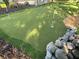 Backyard putting green featuring artificial turf, flags, rock borders, and great design at 1414 N Sherwood Dr, Charleston, SC 29407