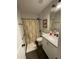 Bathroom with shower/tub combo, white cabinets and contrasting tile floor at 1414 N Sherwood Dr, Charleston, SC 29407