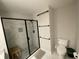 Modern bathroom featuring a glass-enclosed shower with a sleek, black frame and black fixtures at 1414 N Sherwood Dr, Charleston, SC 29407