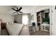Bright bedroom features a ceiling fan, large window, and closet at 1414 N Sherwood Dr, Charleston, SC 29407