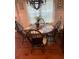 Dining room features hardwood floors, large window, and wooden table with seating for four at 1414 N Sherwood Dr, Charleston, SC 29407