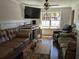 Spacious living room with comfortable seating, natural light, and a modern entertainment center at 1414 N Sherwood Dr, Charleston, SC 29407