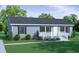 Charming single-story home with a welcoming front porch, neat landscaping, and classic curb appeal at 142-11 Donald Ln, Bonneau, SC 29431