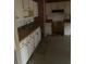 Outdated kitchen features classic white cabinets and tiled backsplash, ready for a modern refresh at 143 Mickler Dr, Ladson, SC 29456