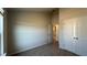 Bedroom with neutral walls, carpet, a closet, and views to another room at 145 Yarrow Way, Moncks Corner, SC 29461