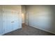 Bedroom with neutral walls, carpet, and a closet with double doors at 145 Yarrow Way, Moncks Corner, SC 29461