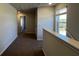 Hallway with a view to a window showing the outside and doors to rooms at 145 Yarrow Way, Moncks Corner, SC 29461