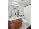 Well-lit bathroom with a vanity, toilet, and shower featuring a decorative shower curtain at 155 Winding River Dr, Johns Island, SC 29455