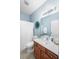 Cozy bathroom with a single vanity, a shower with a curtain, and soothing blue walls at 155 Winding River Dr, Johns Island, SC 29455