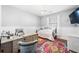 Bright bedroom featuring a desk, decorative rug, hardwood floors, and a cozy bed at 155 Winding River Dr, Johns Island, SC 29455