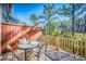 Outdoor deck featuring a table and chairs, ideal for enjoying the surrounding nature views at 155 Winding River Dr, Johns Island, SC 29455