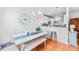 Bright and airy dining room featuring hardwood floors, a modern table setting, and open layout to the kitchen at 155 Winding River Dr, Johns Island, SC 29455