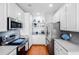 Well-equipped kitchen with stainless steel appliances, white cabinetry, and stylish decor at 155 Winding River Dr, Johns Island, SC 29455