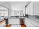 Bright kitchen features white cabinets, stainless steel appliances, and gray subway tile backsplash at 155 Winding River Dr, Johns Island, SC 29455
