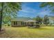 Picturesque backyard with lush lawn, patio seating, and well-maintained landscaping providing an inviting outdoor space at 177 Thousand Oaks Cir, Goose Creek, SC 29445
