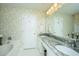 Bathroom with double sinks on granite countertop vanity, large mirror, and soaking tub at 177 Thousand Oaks Cir, Goose Creek, SC 29445