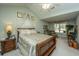 Cozy bedroom with vaulted ceilings, soft green walls and a comfortable armchair at 177 Thousand Oaks Cir, Goose Creek, SC 29445