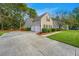 Spacious two-car garage with a long driveway and manicured landscaping, adding convenience and curb appeal at 177 Thousand Oaks Cir, Goose Creek, SC 29445