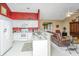 Bright kitchen featuring white cabinets, granite countertops, and open access to the adjacent living area at 177 Thousand Oaks Cir, Goose Creek, SC 29445