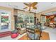 Bright sunroom with wicker furniture, large windows, and access to the backyard at 177 Thousand Oaks Cir, Goose Creek, SC 29445