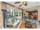 Comfortable sunroom features wicker furniture and multiple windows that let in plenty of natural light at 177 Thousand Oaks Cir, Goose Creek, SC 29445