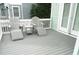 Deck with two white Adirondack chairs, a small table, and a lounge chair at 2 Pelican Reach # Share 11, Isle of Palms, SC 29451