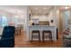 Open-concept living area featuring hardwood floors, stylish furniture, and a view into the modern kitchen at 2 Pelican Reach # Share 11, Isle of Palms, SC 29451