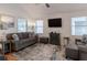 Bright and airy living room featuring a comfortable sofa, stylish decor, and ample natural light at 2 Pelican Reach # Share 11, Isle of Palms, SC 29451
