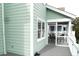 View from the porch to the outside, with a table and chairs visible at 2 Pelican Reach # Share 11, Isle of Palms, SC 29451