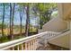 Balcony with white railings, overlooking construction, and trees with green leaves on a sunny day at 2 Townpark Ln # D, Charleston, SC 29412