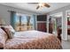 Bedroom featuring a comfortable bed, mounted television and sliding glass door to the outdoor deck at 2 Townpark Ln # D, Charleston, SC 29412