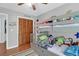 bedroom featuring a bunk bed with toy storage and decor for a playful atmosphere at 2 Townpark Ln # D, Charleston, SC 29412