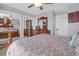 Bedroom with a dresser, closet and comfortable bed covered with a floral patterned quilt at 2 Townpark Ln # D, Charleston, SC 29412