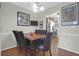 Cozy dining area features a wooden table with seating for six and decor to create an inviting atmosphere at 2 Townpark Ln # D, Charleston, SC 29412