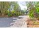 Scenic view of an entrance to 'LaBrosse' community with lush greenery and trees, complemented by well-maintained brick signage at 2 Townpark Ln # D, Charleston, SC 29412