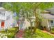 Charming two-story townhouse with brick walkway and a welcoming front entrance with an American flag at 2 Townpark Ln # D, Charleston, SC 29412