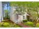 Charming two-story townhouse with brick walkway and a welcoming front entrance with an American flag at 2 Townpark Ln # D, Charleston, SC 29412