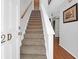 Interior staircase featuring carpeted steps, leading to the upper level of the home at 2 Townpark Ln # D, Charleston, SC 29412