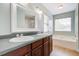 Bathroom boasts dual sinks, generous vanity space, and a soaking tub at 2019 Azalee Ln, Summerville, SC 29483