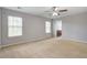 Bright bedroom featuring carpet floors, ceiling fan, and ample natural light at 2019 Azalee Ln, Summerville, SC 29483