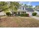 Charming two-story home with landscaped yard and inviting curb appeal on a sunny day at 2019 Azalee Ln, Summerville, SC 29483