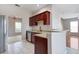 Kitchen boasts granite counters, stainless steel appliances, and cherry wood cabinets at 2019 Azalee Ln, Summerville, SC 29483
