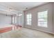 Bright living room featuring hardwood and carpet floors with natural light and modern accents at 2019 Azalee Ln, Summerville, SC 29483