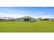 The home's backyard features an expansive green lawn at 202 Bilge Rd, Ridgeville, SC 29472