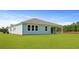The home's backyard features a well-manicured lawn at 202 Bilge Rd, Ridgeville, SC 29472