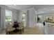Bright dining area leading to living room boasts plenty of windows at 202 Bilge Rd, Ridgeville, SC 29472