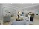 Spacious living room with modern decor flows into the dining and kitchen area at 202 Bilge Rd, Ridgeville, SC 29472