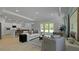 Large living room with open floor plan and easy access to the kitchen and outdoor living at 202 Bilge Rd, Ridgeville, SC 29472